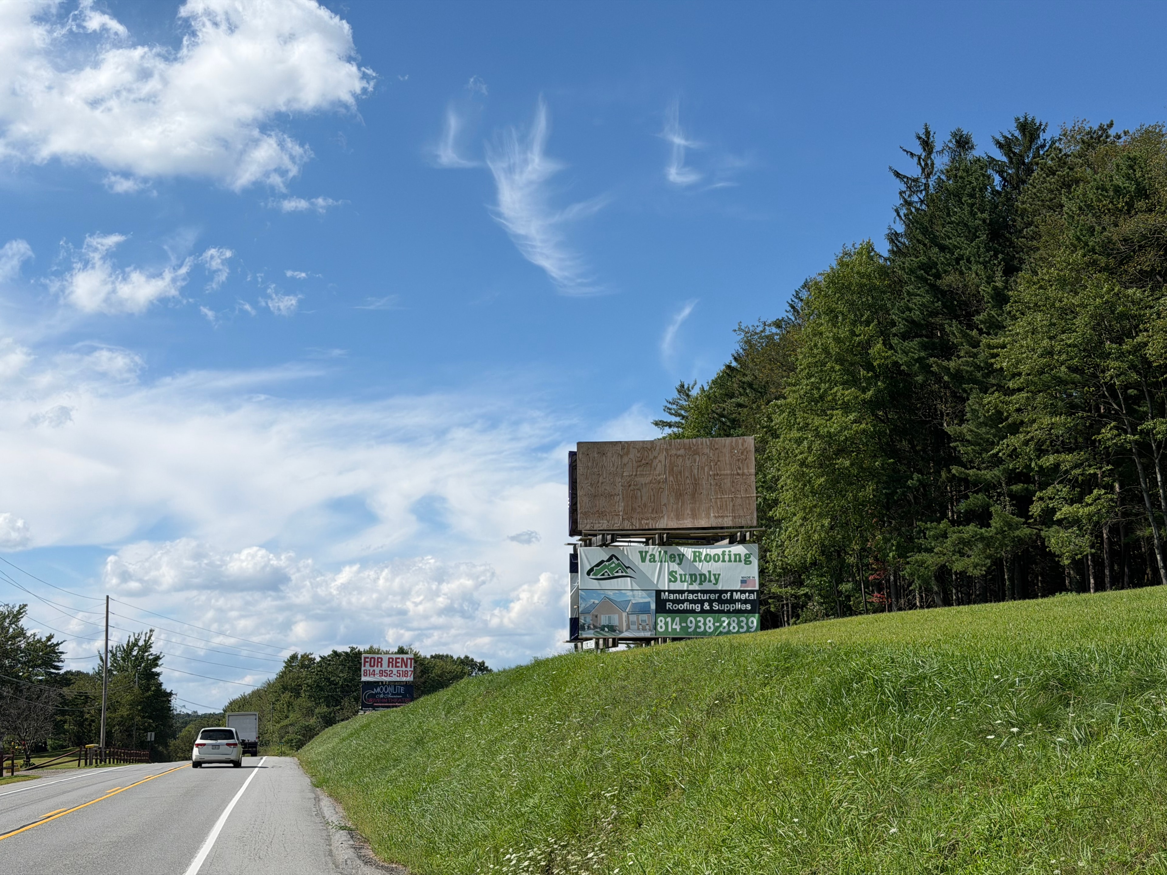 Outdoor billboard installation along a rural road